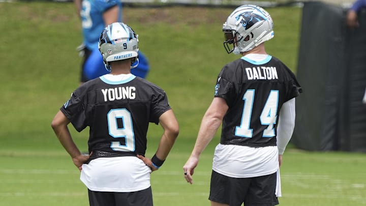 Jun 4, 2024; Charlotte, NC, USA; Carolina Panthers quarterback Bryce Young (9) and quarterback Andy Dalton (14) chat during OTAs. Mandatory Credit: Jim Dedmon-USA TODAY Sports