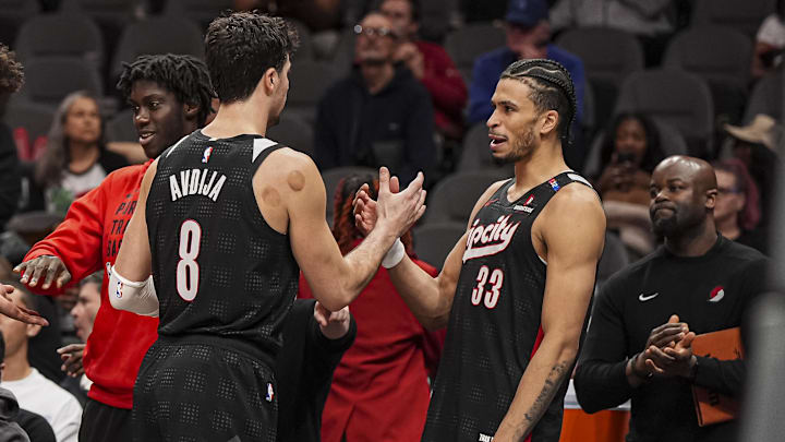Apr 1, 2025; Atlanta, Georgia, USA: Portland Trail Blazers forwards Deni Avdija (8) and  Toumani Camara (33) react late in the game against the Atlanta Hawks during the second half at State Farm Arena. Mandatory Credit: Dale Zanine-Imagn Images