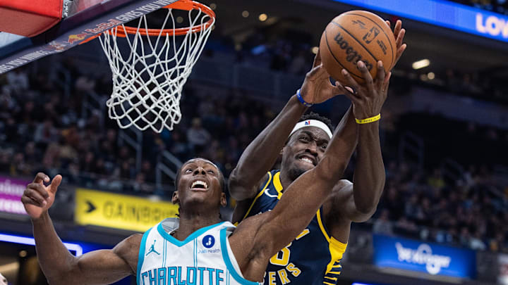 Nov 19, 2025; Indianapolis, Indiana, USA; Charlotte Hornets forward Moussa Diabate (14) and Indiana Pacers forward Pascal Siakam (43) go to rebound the ball in the first half at Gainbridge Fieldhouse. Mandatory Credit: Trevor Ruszkowski-Imagn Images