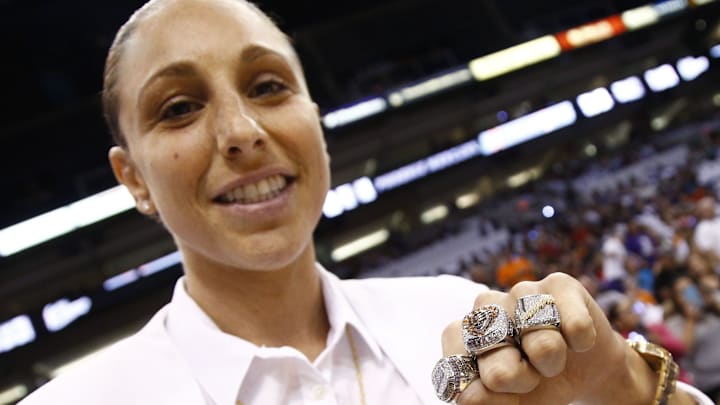 Phoenix Mercury star Diana Taurasi shows off her three WNBA Championship rings during ceremonies at the season opener on June 5, 2015, at US Airways Center in Phoenix.