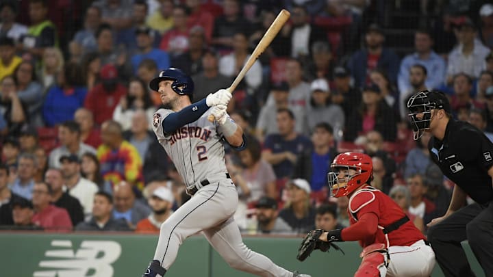 Aug 29, 2023; Boston, Massachusetts, USA;  Houston Astros third baseman Alex Bregman (2) hits a home run during the first inning against the Boston Red Sox at Fenway Park. Mandatory Credit: Bob DeChiara-Imagn Images