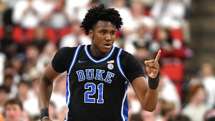 Mar 2, 2026; Raleigh, North Carolina, USA;  Duke Blue Devils center Patrick Ngongba II (21) reacts after scoring against the NC State Wolfpack during the first half at Lenovo Center. 