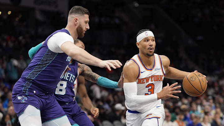Mar 20, 2025; Charlotte, North Carolina, USA; New York Knicks guard Josh Hart (3) passes off under pressure from Charlotte Hornets center Jusuf Nurkic (11) during the first quarter at Spectrum Center. Mandatory Credit: Jim Dedmon-Imagn Images