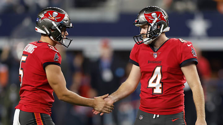 ARLINGTON, TEXAS - DECEMBER 22: Chase McLaughlin #4 and Jack Browning #5 of the Tampa Bay Buccaneers react after McLaughlin kicked a field goal during the third quarter against the Dallas Cowboys at AT&T Stadium on December 22, 2024 in Arlington, Texas. ARLINGTON, TEXAS - DECEMBER 22: Chase McLaughlin #4 and Jack Browning #5 of the Tampa Bay Buccaneers react after McLaughlin kicked a field goal during the third quarter against the Dallas Cowboys at AT&T Stadium on December 22, 2024 in Arlington, Texas.