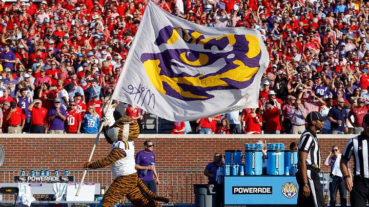 Sep 30, 2023; Oxford, Mississippi, USA; LSU Tigers mascot, Mike, runs a LSU flag onto the field prior to the game against the Mississippi Rebels at Vaught-Hemingway Stadium. Mandatory Credit: Petre Thomas-USA TODAY Sports Sep 30, 2023; Oxford, Mississippi, USA; LSU Tigers mascot, Mike, runs a LSU flag onto the field prior to the game against the Mississippi Rebels at Vaught-Hemingway Stadium. Mandatory Credit: Petre Thomas-USA TODAY Sports