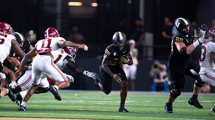 Vanderbilt Commodores running back Sedrick Alexander (28) hits a hole against the Alabama Crimson Tide during their game at Vanderbilt Stadium in Nashville, Tenn., Saturday, Oct. 5, 2024.