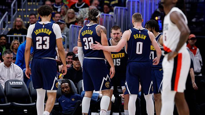 Apr 6, 2026; Denver, Colorado, USA; Denver Nuggets center Nikola Jokic (15) reacts after a play as forward Cam Johnson (23) and forward Aaron Gordon (32) and guard Christian Braun (0) and guard Jamal Murray (27) look on in the fourth quarter against the Portland Trail Blazers at Ball Arena. Mandatory Credit: Isaiah J. Downing-Imagn Images