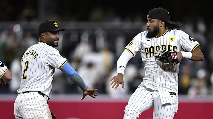 Sep 16, 2024; San Diego, California, USA; San Diego Padres shortstop Xander Bogaerts (2) and right fielder Fernando Tatis Jr. (23) celebrate on the field after defeating the Houston Astros at Petco Park. Mandatory Credit: Orlando Ramirez-Imagn Images