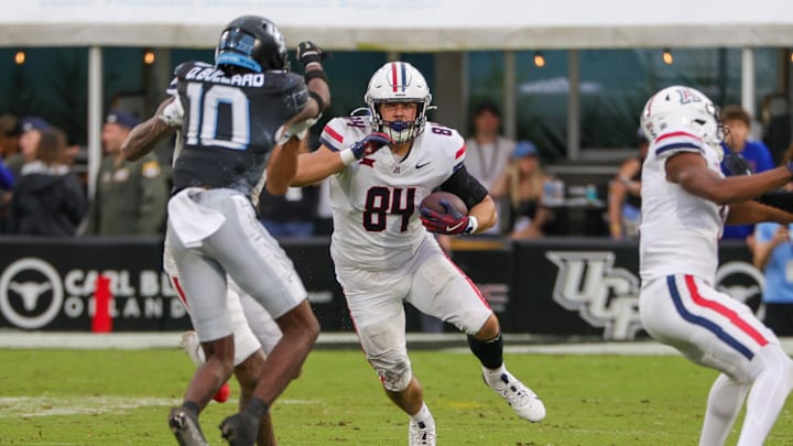 Nov 2, 2024; Orlando, Florida, USA; Arizona Wildcats tight end Sam Olson (84) runs the ball against the UCF Knights during the second half at FBC Mortgage Stadium. Mandatory Credit: Mike Watters-Imagn Images