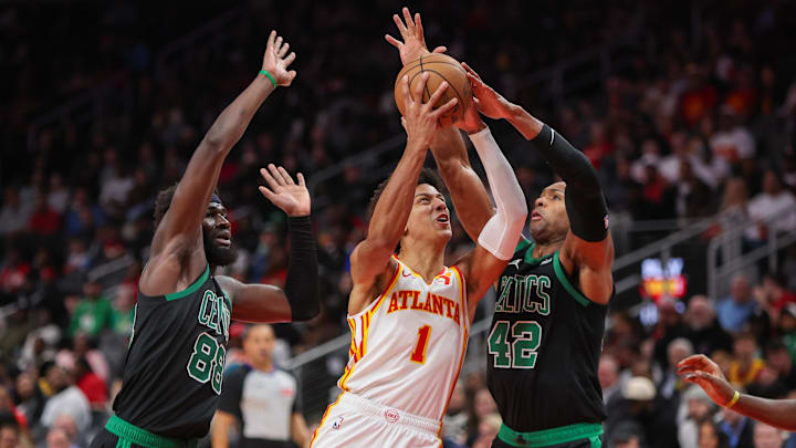 Nov 4, 2024; Atlanta, Georgia, USA; Atlanta Hawks forward Jalen Johnson (1) is defended by Boston Celtics center Neemias Queta (88) and center Al Horford (42) in the third quarter at State Farm Arena. Mandatory Credit: Brett Davis-Imagn Images
