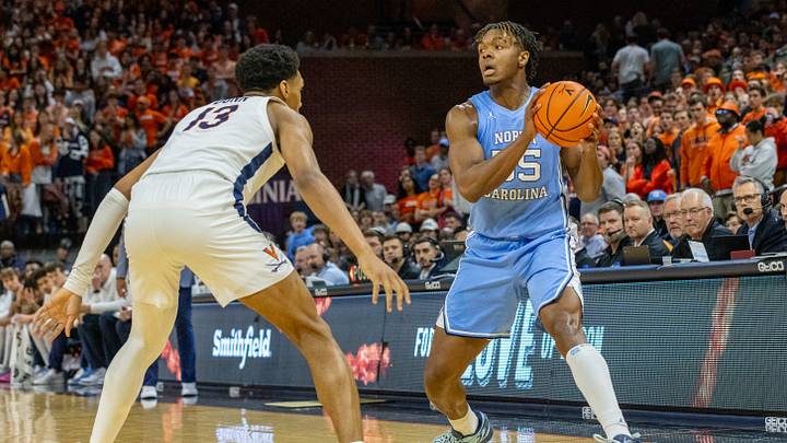 Feb 24, 2024; Charlottesville, Virginia, USA; North Carolina Tar Heels forward Harrison Ingram (55) looks to pass the ball while Virginia Cavaliers Ryan Dunn (13) defends during the first half against the Virginia Cavaliers at John Paul Jones Arena. Mandatory Credit: Hannah Pajewski-USA TODAY Sports Feb 24, 2024; Charlottesville, Virginia, USA; North Carolina Tar Heels forward Harrison Ingram (55) looks to pass the ball while Virginia Cavaliers Ryan Dunn (13) defends during the first half against the Virginia Cavaliers at John Paul Jones Arena. Mandatory Credit: Hannah Pajewski-USA TODAY Sports