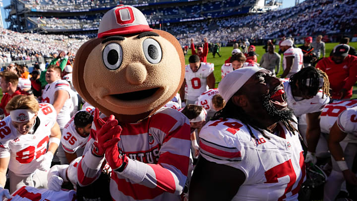 Ohio State Buckeyes offensive lineman Donovan Jackson (74) and mascot Brutus celebrate following the NCAA football game against the Penn State Nittany Lions at Beaver Stadium in University Park, Pa. on Monday, Nov. 4, 2024. Ohio State won 20-13.