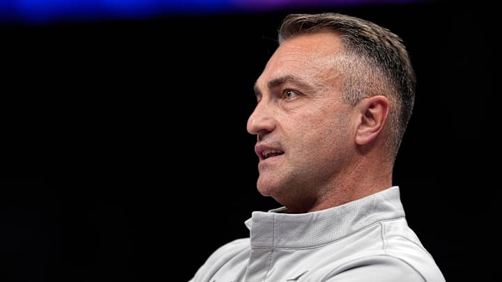 Toronto Raptors head coach Darko Rajakovic watches game play during overtime against the Charlotte Hornets at Spectrum Center. Toronto Raptors head coach Darko Rajakovic watches game play during overtime against the Charlotte Hornets at Spectrum Center.