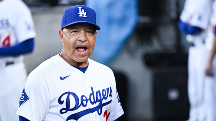 Apr 24, 2026; Los Angeles, California, USA;  Los Angeles Dodgers manager Dave Roberts (30) speaks in the dugout before the game against the Chicago Cubs at Dodger Stadium. Mandatory Credit: William Liang-Imagn Images