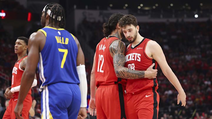 Apr 20, 2025; Houston, Texas, USA; Houston Rockets center Steven Adams (12) talks with center Alperen Sengun (28) after a play during the third quarter against the Golden State Warriors at Toyota Center. Mandatory Credit: Troy Taormina-Imagn Images