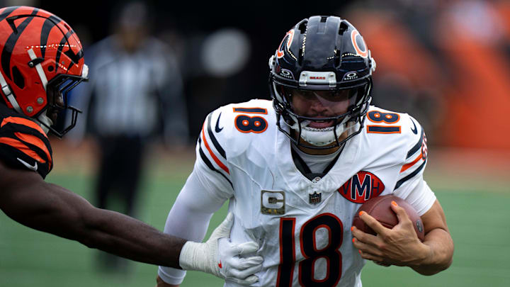Chicago Bears quarterback Caleb Williams (18) runs by Cincinnati Bengals linebacker Oren Burks (42) in the fourth quarter of the NFL football game between Chicago Bears and Cincinnati Bengals at Paycor Stadium in Cincinnati on Nov. 2, 2025.