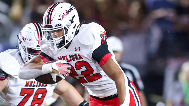 Melissa's Jeremiah Tabor dives for yardage in a game against Lucas Lovejoy on Oct. 4, 2024. 
