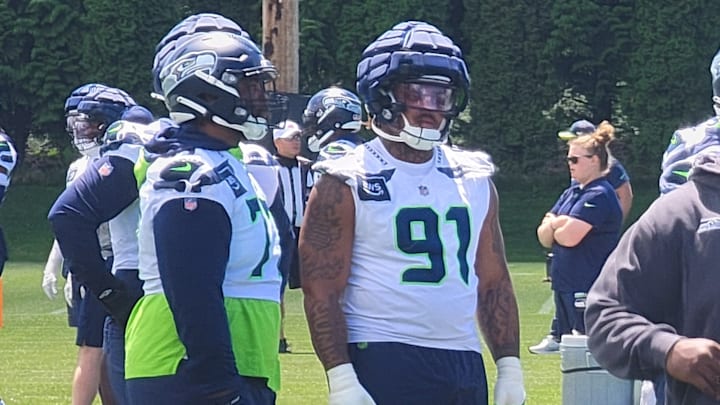 Seattle Seahawks rookie Byron Murphy looks on as an assistant coach instructs on an upcoming drill during mandatory minicamp. Seattle Seahawks rookie Byron Murphy looks on as an assistant coach instructs on an upcoming drill during mandatory minicamp.
