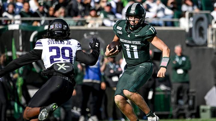Michigan State’s Alessio Milivojevic, right, runs for a gain against Northwestern during the second quarter on Saturday, Oct. 17, 2026, at Spartan Stadium in East Lansing. Michigan State’s Alessio Milivojevic, right, runs for a gain against Northwestern during the second quarter on Saturday, Oct. 17, 2026, at Spartan Stadium in East Lansing.