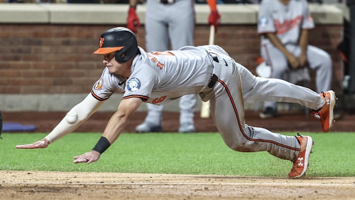 Aug 20, 2024; New York City, New York, USA; Baltimore Orioles first baseman Ryan Mountcastle (6) slides into home plate in the ninth inning against the New York Mets at Citi Field. Aug 20, 2024; New York City, New York, USA; Baltimore Orioles first baseman Ryan Mountcastle (6) slides into home plate in the ninth inning against the New York Mets at Citi Field.