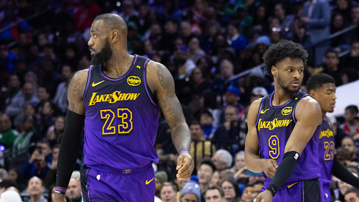 Jan 28, 2025; Philadelphia, Pennsylvania, USA; Los Angeles Lakers forward LeBron James (23) and guard Bronny James (9) look on during the third quarter against the Philadelphia 76ers at Wells Fargo Center. Mandatory Credit: Bill Streicher-Imagn Images