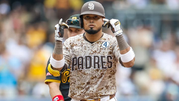 Jun 1, 2025; San Diego, California, USA; San Diego Padres first baseman Luis Arraez (4) celebrates after hitting a double during the sixth inning against the Pittsburgh Pirates at Petco Park. Mandatory Credit: David Frerker-Imagn Images