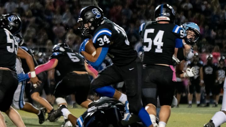 Central Bucks South running back Braylen Cape carries the ball in a football game against North Penn, on Friday, October 4, 2024, at Central Bucks South in Warrington. The undefeated Titans continue their streak, beating the Knights 14-6.
