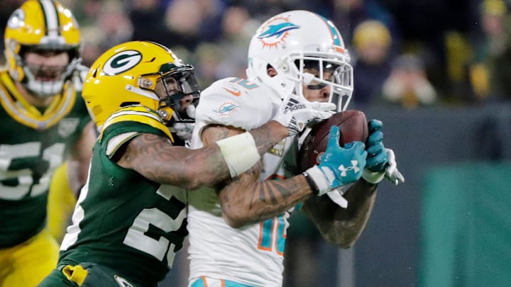 Green Bay Packers cornerback Jaire Alexander is shown making a tackle against the Dolphins in 2018.