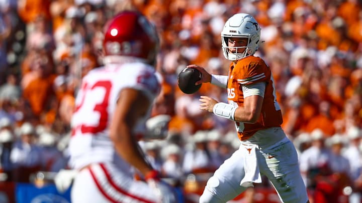 Oct 11, 2025; Dallas, Texas, USA;  Texas Longhorns quarterback Arch Manning (16) throws as Oklahoma Sooners defensive back Eli Bowen (23) defends during the first half at the Cotton Bowl. Mandatory Credit: Kevin Jairaj-Imagn Images