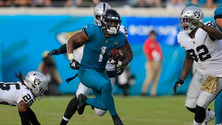 Jacksonville Jaguars running back Travis Etienne Jr. (1) rushes for yards during the fourth quarter of a regular season NFL football matchup Sunday, Nov. 6, 2022 at TIAA Bank Field in Jacksonville. Jacksonville Jaguars running back Travis Etienne Jr. (1) rushes for yards during the fourth quarter of a regular season NFL football matchup Sunday, Nov. 6, 2022 at TIAA Bank Field in Jacksonville.