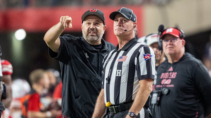Nebraska head coach Matt Rhule points out something on the scoreboard to a referee during the Illinois game.