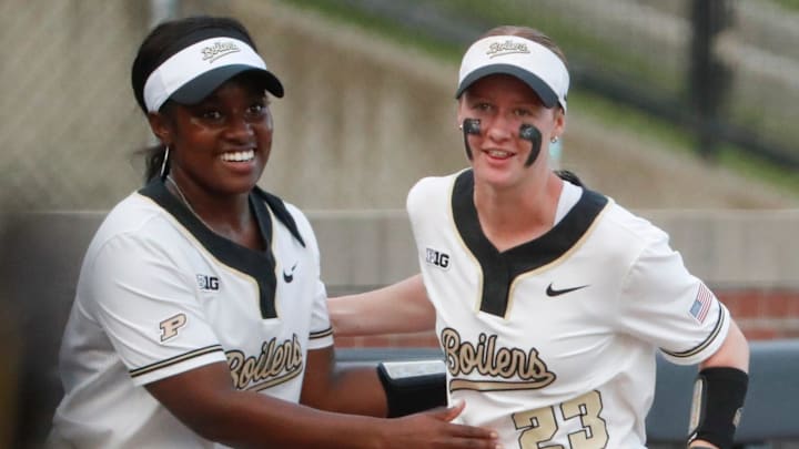 Purdue Boilermakers outfielder Kyndall Bailey (8) celebrates with Ashlynn Campbell (23) 