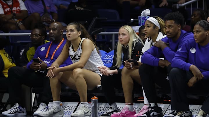 Jul 29, 2025; Washington, District of Columbia, USA; Injured Chicago Sky guard Hailey Van Lith (M) and Sky forward Angel Reese (M-R) look on from the bench against the Washington Mystics in the second half at CareFirst Arena. Mandatory Credit: Geoff Burke-Imagn Images