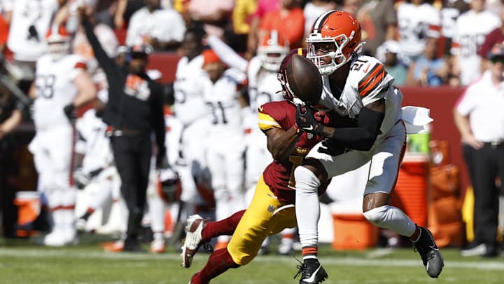 Oct 6, 2024; Landover, Maryland, USA; Cleveland Browns cornerback Denzel Ward (21) breaks up a pass intended for Washington Commanders wide receiver Terry McLaurin (17) during the second quarter at NorthWest Stadium. Mandatory Credit: Geoff Burke-Imagn Images