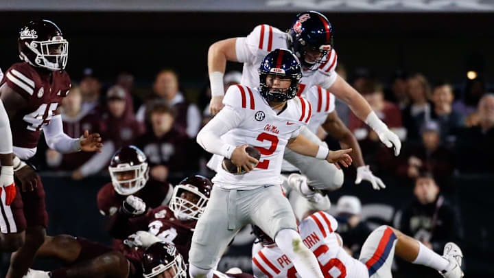 Nov 23, 2023; Starkville, Mississippi, USA; Mississippi Rebels quarterback Jaxson Dart (2) runs the