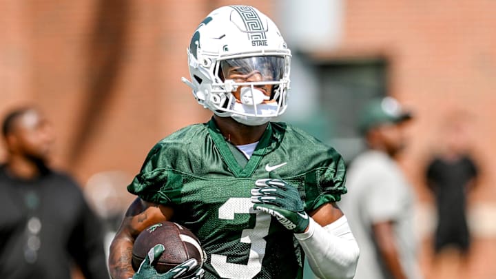 Michigan State's Montorie Foster Jr. runs after a catch during the first day of football camp on Tuesday, July 30, 2024, in East Lansing.