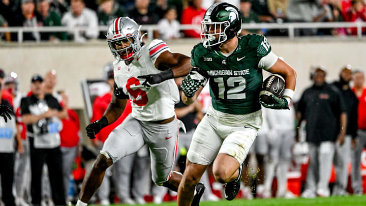 Michigan State's Jack Velling, right, runs after a catch as Ohio State's Sonny Styles closes in during the second quarter on Saturday, Sept. 28, 2024, at Spartan Stadium in East Lansing.