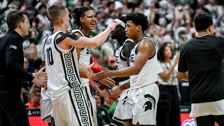 Michigan State's Jeremy Fears Jr., right, celebrates with teammates during a timeout against Illinois during overtime on Saturday, Feb. 7, 2026, at the Breslin Center in East Lansing.