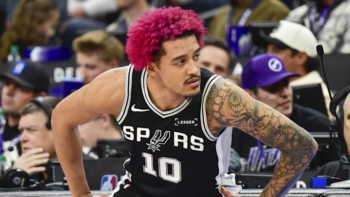 Jan 22, 2026; Salt Lake City, Utah, USA; San Antonio Spurs forward Jeremy Sochan (10) stretches before substituting in during the second half against the Utah Jazz at Delta Center. Mandatory Credit: Peter Creveling-Imagn Images