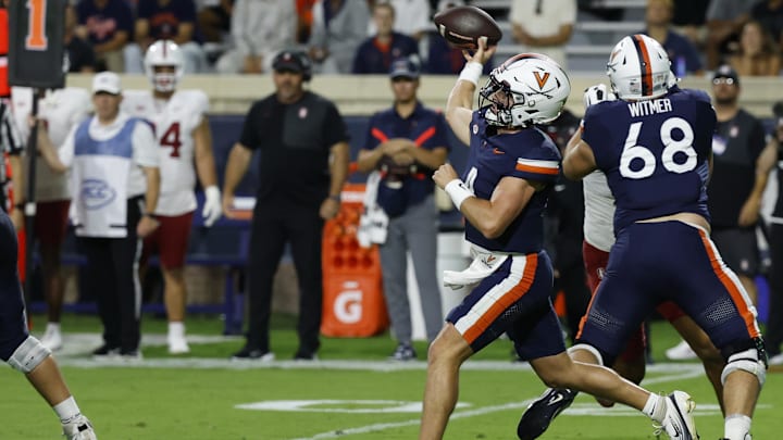 Sep 20, 2025; Charlottesville, Virginia, USA; Virginia Cavaliers quarterback Chandler Morris (4) throws a touchdown pass to Cavaliers wide receiver Trell Harris (not pictured) against the Stanford Cardinal during the first quarter at Scott Stadium. Mandatory Credit: Geoff Burke-Imagn Images Sep 20, 2025; Charlottesville, Virginia, USA; Virginia Cavaliers quarterback Chandler Morris (4) throws a touchdown pass to Cavaliers wide receiver Trell Harris (not pictured) against the Stanford Cardinal during the first quarter at Scott Stadium. Mandatory Credit: Geoff Burke-Imagn Images