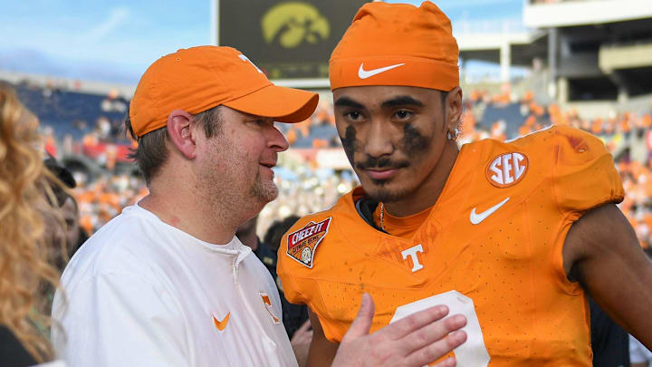 Tennessee head coach Josh Heupel turns to quarterback Nico Iamaleava (8) after their post game interview after winning the Citrus Bowl NCAA College football game on Monday, January 1, 2024 in Orlando, Fla. against Iowa.