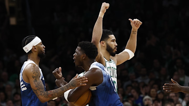 Jan 10, 2024; Boston, Massachusetts, USA; Minnesota Timberwolves guard Anthony Edwards (5) thought a foul should have been called as Boston Celtics forward Jayson Tatum (0) signals for a jump ball during the second half at TD Garden. Jan 10, 2024; Boston, Massachusetts, USA; Minnesota Timberwolves guard Anthony Edwards (5) thought a foul should have been called as Boston Celtics forward Jayson Tatum (0) signals for a jump ball during the second half at TD Garden.