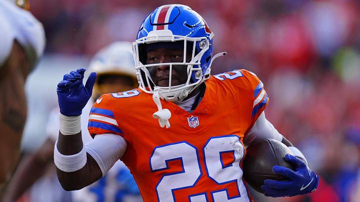 Jan 4, 2026; Denver, Colorado, USA; Denver Broncos cornerback Ja'quan McMillian (29) runs with the ball during the first half against the Los Angeles Chargers at Empower Field at Mile High. 