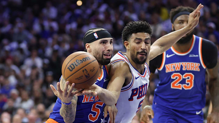 May 8, 2026; Philadelphia, Pennsylvania, USA; Philadelphia 76ers guard Quentin Grimes (5) knocks the ball from New York Knicks guard Jose Alvarado (5) during the second quarter of game three of the second round of the 2026 NBA Playoffs at Xfinity Mobile Arena. Mandatory Credit: Bill Streicher-Imagn Images