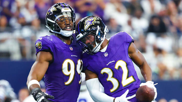 Sep 22, 2024; Arlington, Texas, USA;  Baltimore Ravens safety Marcus Williams (32) celebrates with Baltimore Ravens linebacker Odafe Oweh (99) after recovering a fumble during the first half at AT&T Stadium. Mandatory Credit: Kevin Jairaj-Imagn Images