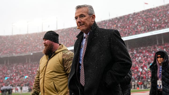 Former Ohio State Buckeyes coach Urban Meyer walks across the field during the NCAA football game against the Indiana Hoosiers at Ohio Stadium in Columbus on Monday, Nov. 25, 2024. Ohio State won 38-15.