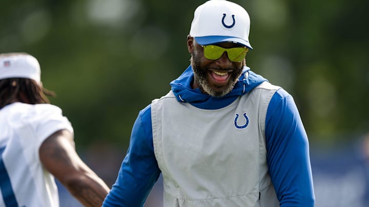 Indianapolis Colts wide receivers coach Reggie Wayne shares a laugh with a player Friday, July 25, 2025, ahead of training camp held at Grand Park in Westfield.