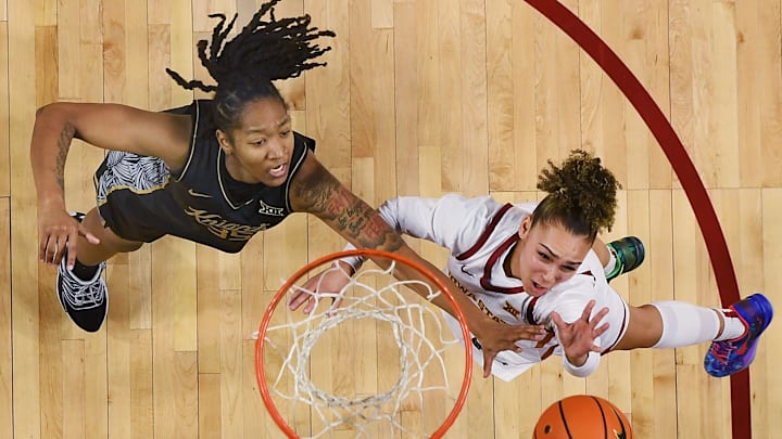 Iowa State Cyclones' guard Jada Williams (8) lays up the ball around UCF Knights center Khyala Ngodu (35) during the second quarter in the Big-12 women’s basketball on Jan. 31, 2026, at Hilton Coliseum in Ames, Iowa.