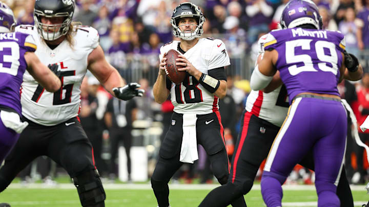 Atlanta Falcons quarterback Kirk Cousins (18) looks to throw against the Minnesota Vikings during the first quarter at U.S. Bank Stadium in Minneapolis on Dec. 8, 2024. Atlanta Falcons quarterback Kirk Cousins (18) looks to throw against the Minnesota Vikings during the first quarter at U.S. Bank Stadium in Minneapolis on Dec. 8, 2024.