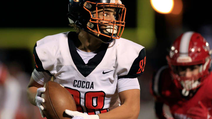 Cocoa's Jayvan Boggs (88) hauls in a reception for a touchdown score as Bradford's Gavin Cook (3) can't catch him during the third quarter of a FHSAA Class 2S state semifinal matchup at Bradford High School in Starke. The Cocoa Tigers outlasted the Bradford Tornadoes 31-21. [Corey Perrine/Florida Times-Union]

Flgai 120422 Cocoa Bradford Fb 22